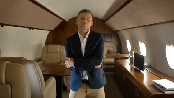 Cheerful Confident Businessman Dancing Inside of Luxury Jet