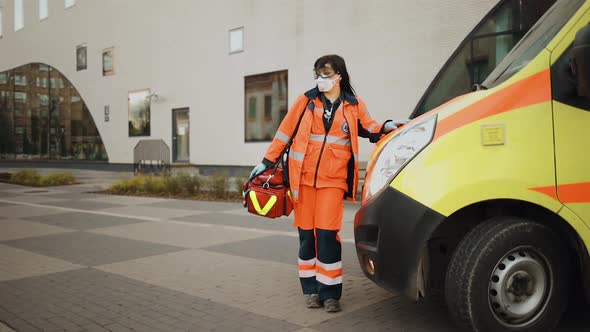 Establishing Shot Paramedic Stands Near Ambulance