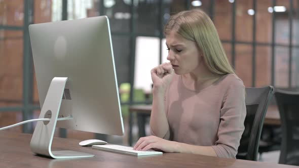 Sick Woman Having Coughing While Working on Computer