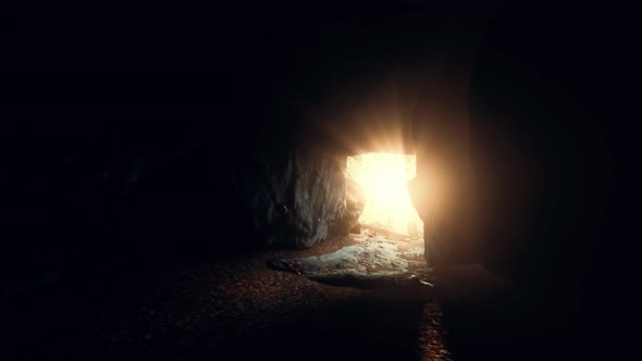 Sunlight Filters Into a Wet Stone Cave