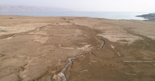 Aerial view of dry salt river stream along the Dead sea, Jordan Rift Valley, Israel.