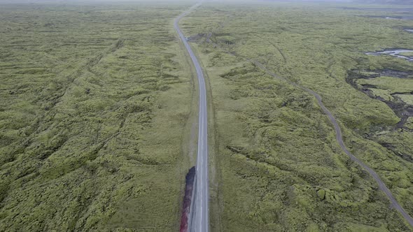 Following the road from above as it cuts right through the moss covered Eldhraun Lava field