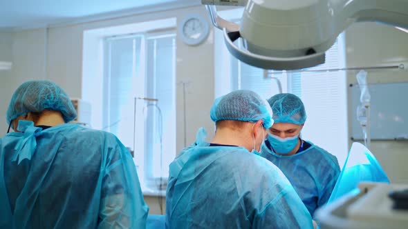 Surgeons and assistant in the operating room