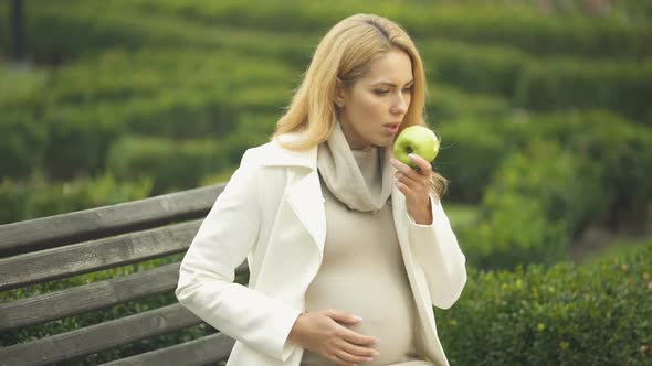 Expecting Woman Feeling Nausea While Eating Apple, Morning Sickness, Toxemia