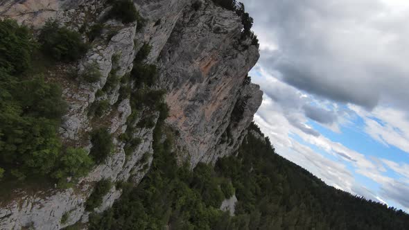 Aerial Cinematic Shot High Speed Sport Fpv Drone Flying Over Natural Mountain Cliff Surrounded