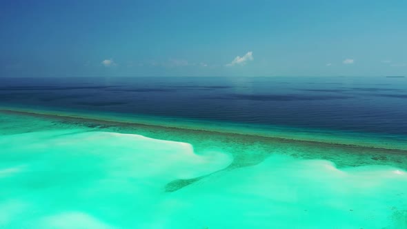 Aerial nature of marine lagoon beach break by shallow lagoon and white sandy background of a dayout 