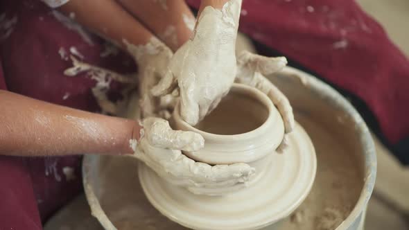 Joint Work Production of Handmade Tableware the Young Couple Potter Makes a Pitcher Out of Clay Top