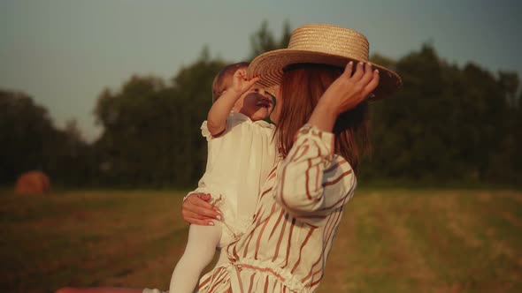 Young mother with baby hugging tenderly