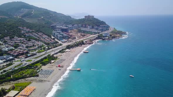 Top View Of Beach Resort Town By Blue Sea