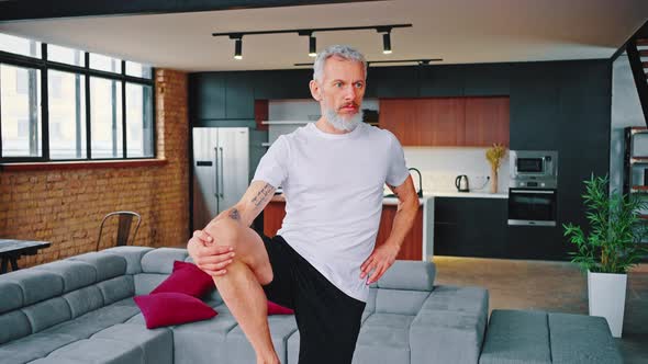 Sporty Elderly Guy Practicing Yoga Indoors