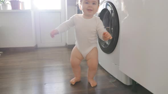 Cute Smiling Baby Girl Learning to Walk