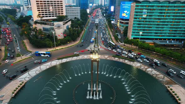 Aerial view of the city traffics at the Hotel Indonesia Roundabout