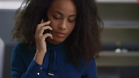 Business Woman Calling Phone in Workplace