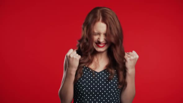 Portrait of Girl with Red Hair Shows YES Gesture. Surprised Excited Happy Woman