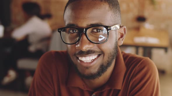 Happy Afro-American Man in Glasses Smiling at Camera