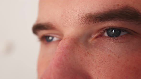 Eyes of an Caucasian Man. Closeup View of a Person's Face. The Man Is Looking at the Camera. The Man