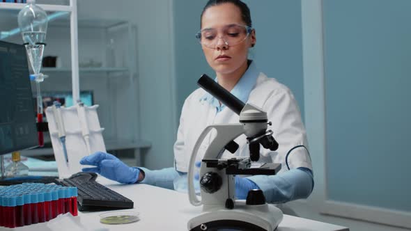 Chemistry Scientist Using Research Equipment in Laboratory