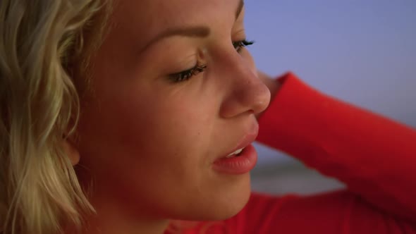 Woman on beach at dusk 4k