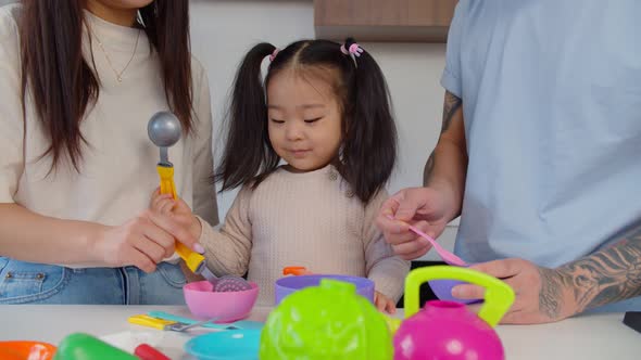 Asian Preschool Age Girl Playing Kids Kitchen Set Toy