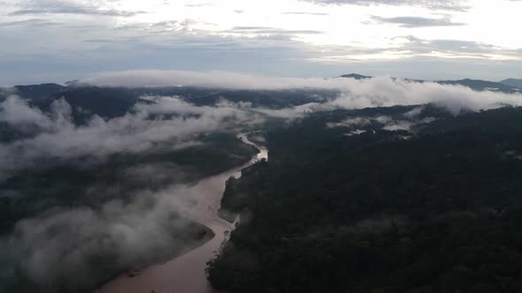 Aerial view of a tropical river with a brown coloration due to the mud