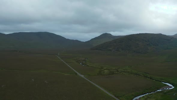 Aerial Panoramic Footage of Landscape with Mountains in Background