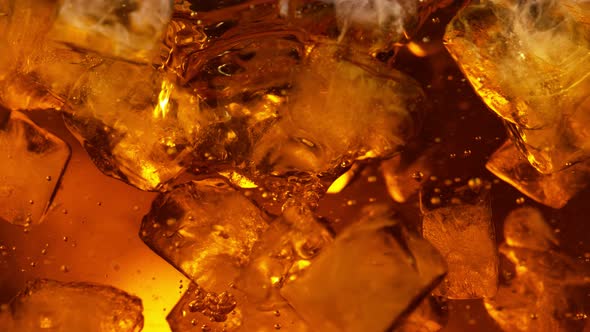 Super Slow Motion Shot of Whirling Fresh Cola and Ice Cubes at 1000Fps