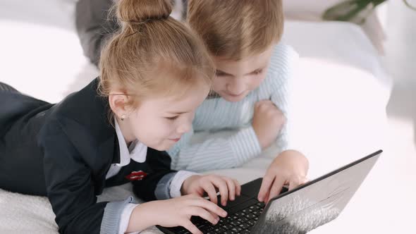 Kids of Primary School Are Studying Online at Home During Quarantine