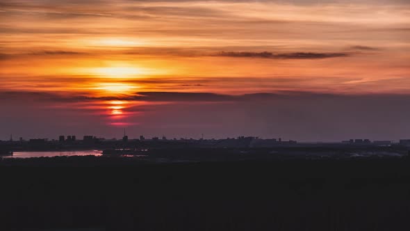 Beautiful Colorful Timelapse Sunset at the Sea, Sun Go Down, Orange Clouds Flow in Sky