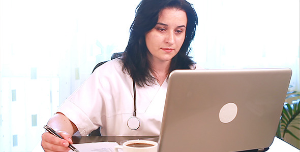 Doctor Working on Her Laptop Computer 