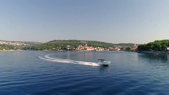 Aerial view of speed boat sailing at Adriatic sea near Brac island, Croatia.