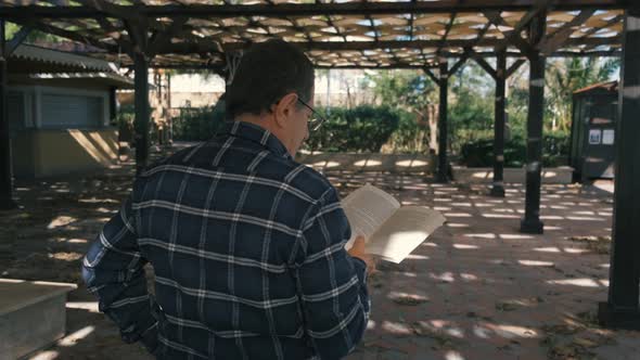 Adult Man Reading Book