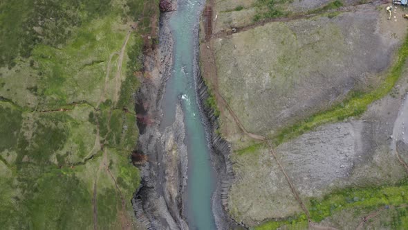 Top View Of Blue-Green Water Flowing In Columnar Basalt Rock Formations In Studlagil, East Iceland.