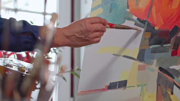 Woman Artist Applying Paint with Brush Strokes on Canvas Brush Closeup