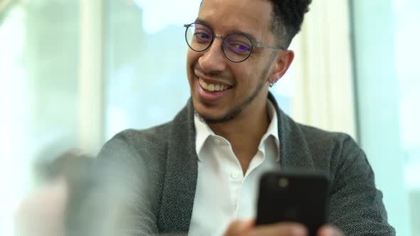 Businessman video calling on a smartphone