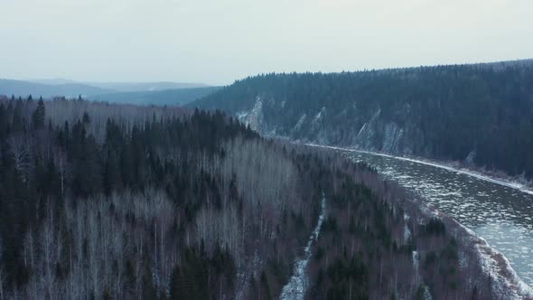 Aerial View of the Cold River Rocks and Forest in Early Winter