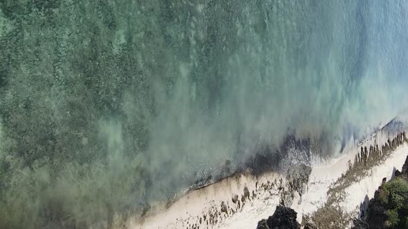 Vertical Video of the Ocean Near the Coast of Zanzibar Tanzania Aerial View