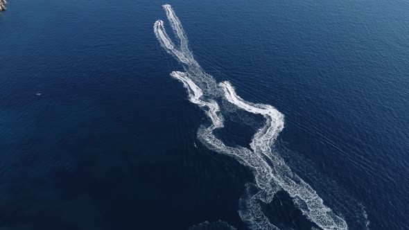 Aerial view of people riding on a bike jet skis in the sea. tourist water entertainment on summer 