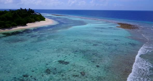 Beautiful overhead clean view of a sunshine white sandy paradise beach and blue ocean background