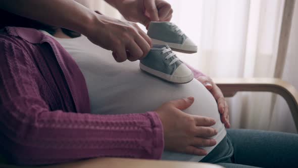 Pregnant Couple Feels Love and Relax at Home