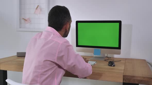 Unrecognizable Men Using Computer Indoor