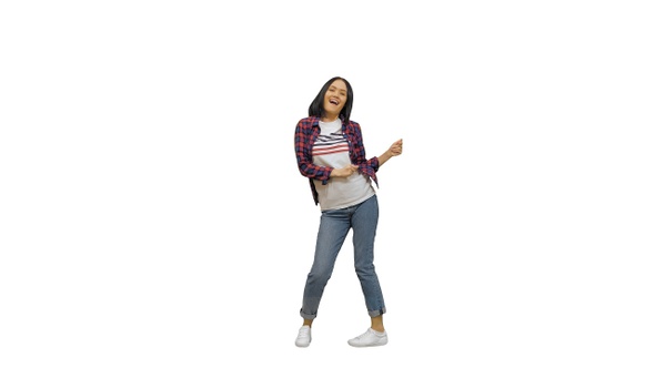 Happy Young Casual Woman Dancing and Smiling on White Background