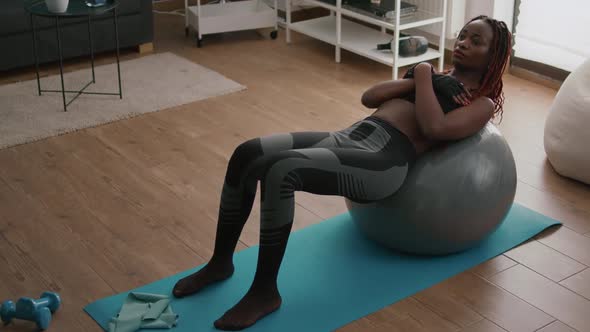 Athletic Black Woman Doing Morning Fitness Workout in Living Room