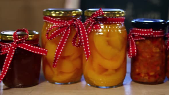 Jars of pestos, jam and preserves on display counter