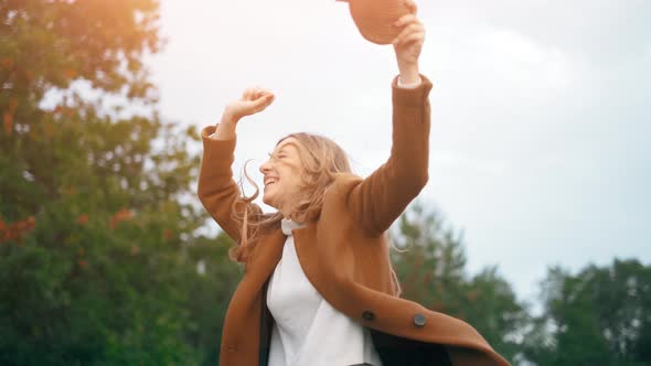 The Beautiful Woman Happy and Excited Is Expressing Winning Gesture