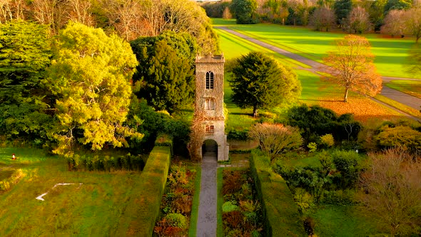  Drone panning down over the gardens and old towers. 