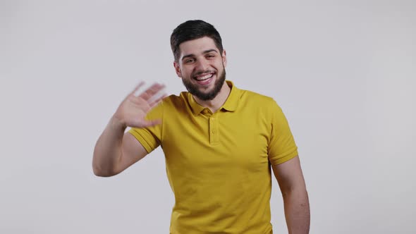 Young Friendly Man Waving Hand  Hello