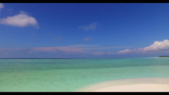 Aerial drone travel of idyllic lagoon beach time by blue ocean with white sand background of a dayou