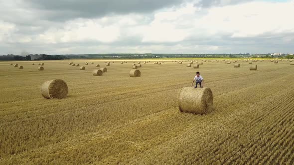 Boy Walking In Field. Adorable preschooler boy walking happily in field