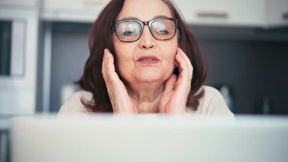 Portrait of a Senior Mature Woman Making a Video Call with Family or Friends