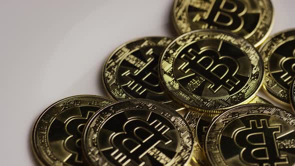 Rotating shot of Bitcoins (digital cryptocurrency) - BITCOIN 0304